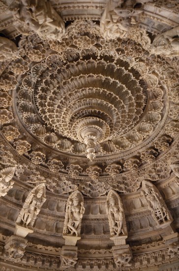 INDIA, Rajasthan, Mount Abu, Dilwara Temples. Vimal Vasahi Jain temple 1031 A.D. Detail of carved white marble central ceiling with central pendant tapered to form point like a lotus flower.