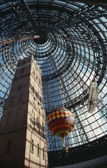 AUSTRALIA, Victoria, Melbourne, "Looking up at the old Shot Tower, hot air balloon and bi-plane inside Melbourne shopping centre."