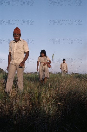 COLOMBIA, Casanare, Llanos Orientales, Cuiva Indians  recently contacted  now clothed  returning to missionised village in the Llanos  close to river Casanare  Tribal Indigenous Colombian Columbia Hispanic Indegent Latin America Latino South America