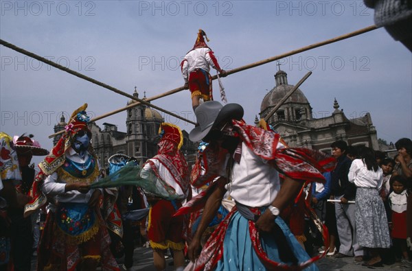MEXICO, Mexico City, "Our Lady of Guadelope Festival dancers, musicians and acrobats in front of the Basilica."