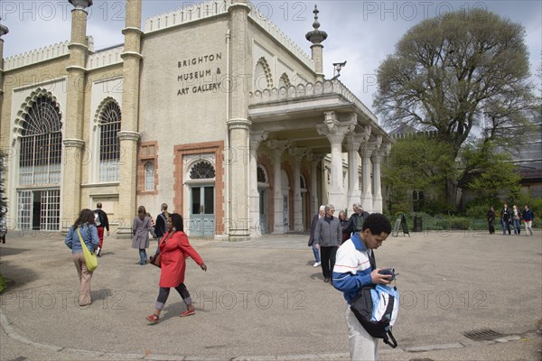 ENGLAND, East Sussex, Brighton, Tourists outside the entrance to the Museum.