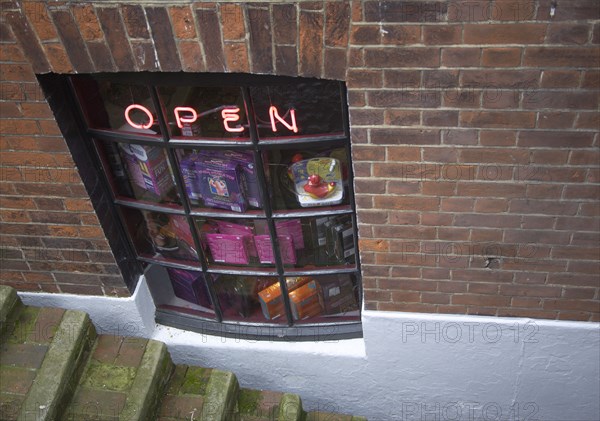 ENGLAND, East Sussex, Brighton, Basement sex shop selling marital aids in a tiny alleyway in the Lanes area.