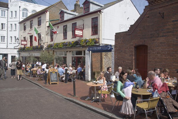 ENGLAND, East Sussex, Brighton, "People sat outside Donatello’s Italian restaurant in Brighton Place, The Lanes"