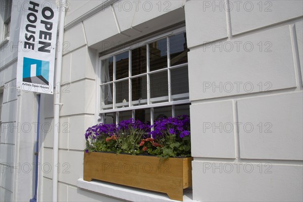 ENGLAND, East Sussex, Brighton, "Open house for Brighton fesitval, with colourful flowers in window boxes."