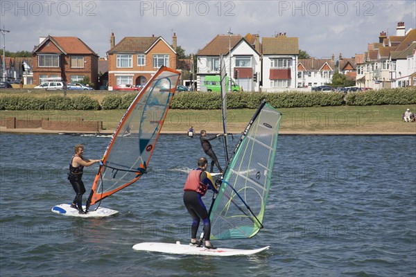 ENGLAND, East Sussex, Brighton, Hove lagoon with windsurfers