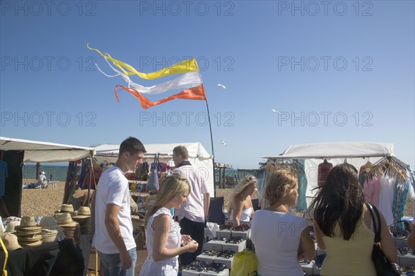 ENGLAND, East Sussex, Brighton, MArket stall on the seafront beside the ruins of the West Pier.