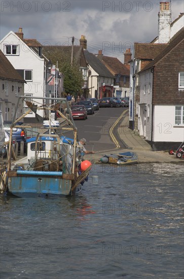 ENGLAND, Hampshire, Emsworth, Fishing boat next to slipway in the harbour .