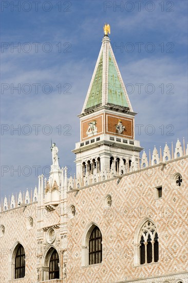 ITALY, Veneto, Venice, The Campanile tower in Piazza San Marco behind the facade of the Doges Palace