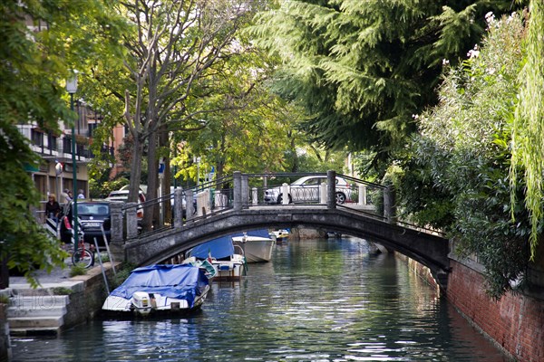 ITALY, Veneto, Venice, A bridge across a canal on the Lido