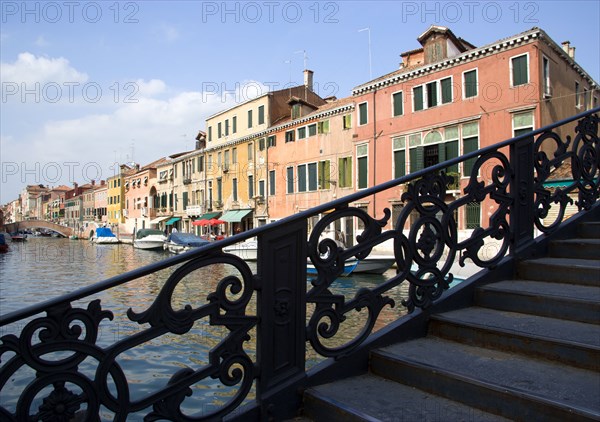 ITALY, Veneto, Venice, A wrought iron bridge heading north out of the Ghetto Novo onto Fondamenta Degli Ormesini in Cannaregio district