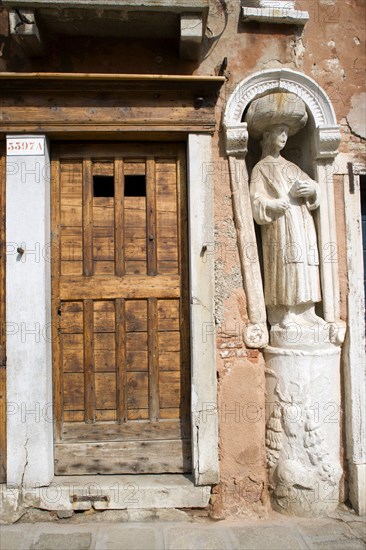 ITALY, Veneto, Venice, A stone figure of a Moor beside Tintoretto's house on Fondamenta dei Mori in the Cannaregio district