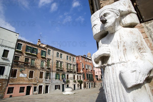 ITALY, Veneto, Venice, One of the three Mori in the Campo di Mori in the Cannaregio district. With a brass nose he depicts Signor Antonio Rioba a focus of malcious fun and satire