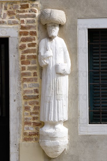 ITALY, Veneto, Venice, "One of the stone Moors in the Campo dei Mori supposedly depicting one of the Mastelli brothers, merchants from the Moorea or Peleponnese"
