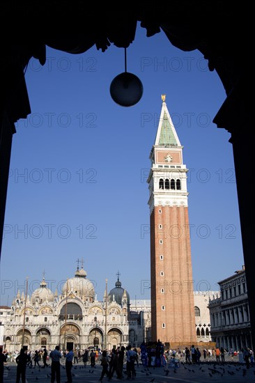 ITALY, Veneto, Venice, The Campanile and Basilica of St Mark in Piazza San Marco filled with tourists