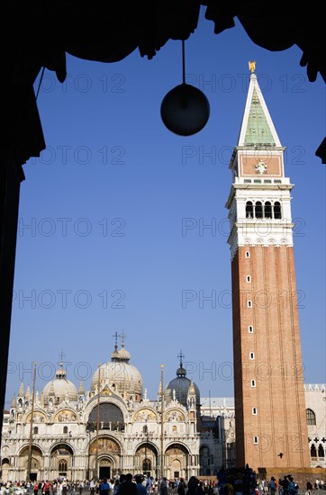 ITALY, Veneto, Venice, The Campanile and Basilica of St Mark in Piazza San Marco filled with tourists