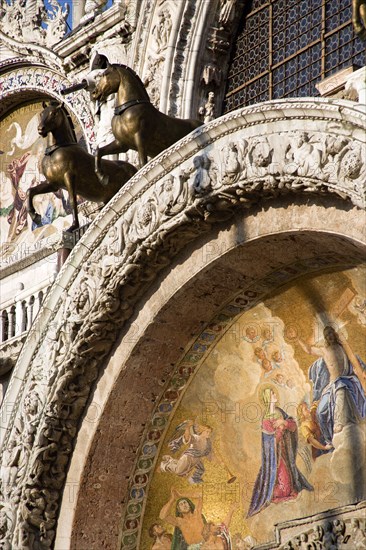 ITALY, Veneto, Venice, The bronze Horses of St Mark and the 17th Century mosaics on the facade of St Marks Basilica