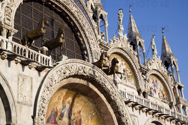 ITALY, Veneto, Venice, The bronze Horses of St Mark and the 17th Century mosaics on the facade of St Marks Basilica