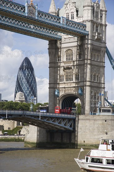 ENGLAND, London, Detail of  Tower Bridge on the River Thames with the Gherkin tower seen through the bridge.