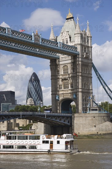 ENGLAND, London, Detail of  Tower Bridge on the River Thames with the Gherkin tower seen through the bridge.