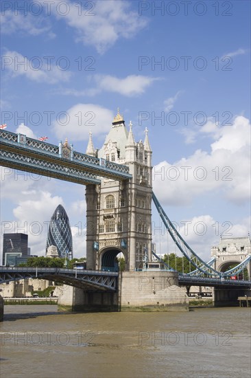 ENGLAND, London, Detail of  Tower Bridge on the River Thames with the Gherkin tower seen through the bridge.