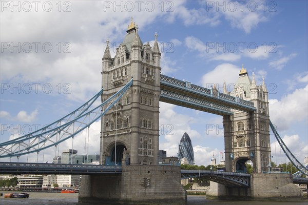 ENGLAND, London, Detail of  Tower Bridge on the River Thames with the Gherkin tower seen through the bridge.