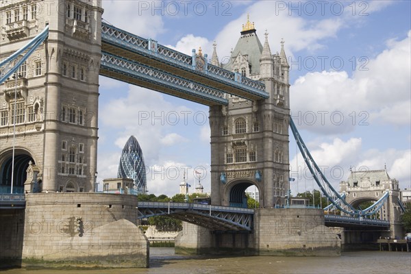 ENGLAND, London, Detail of  Tower Bridge on the River Thames with the Gherkin tower seen through the bridge.