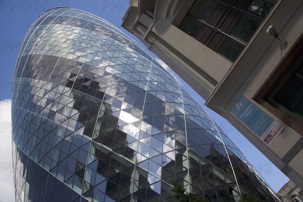 ENGLAND, London, The Swiss Re building 30 St Mary Axe alternatively known as the Gherkin. Designed by Architect Sir Norman Foster.