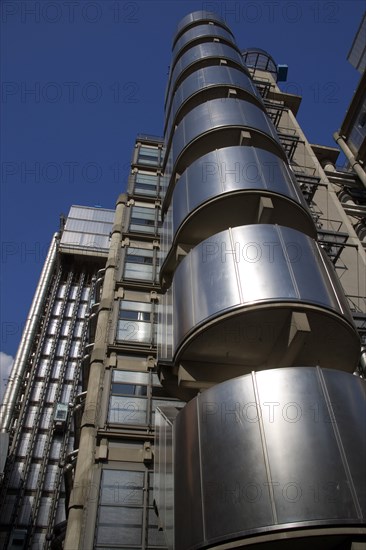 ENGLAND, London, Lloyds of London building polished metal exterior with elevators on the outside. Deigned by Architect Sir Norman Foster.