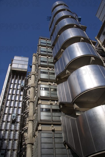 ENGLAND, London, Lloyds of London building polished metal exterior with elevators on the outside. Deigned by Architect Sir Norman Foster.