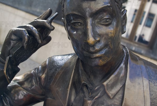 ENGLAND, London, Detail of Liffe Trader Statue a modern sculpture by Stephen Melton stands in Walbrook almost opposite Cannon Street Station. It shows a Yuppie trader conducting business on a mobile cell phone.