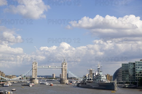 ENGLAND, London, View along the river Thames from London Bridge toward HMS Belfast and Tower Bridge.