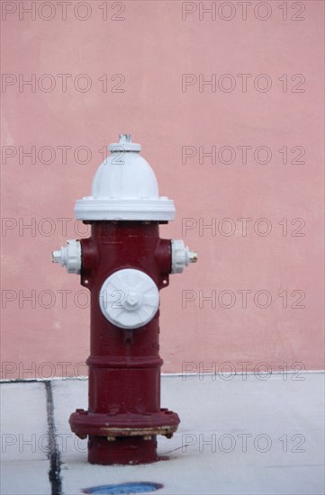 USA, Florida, Miami, Fire Hydrant on pavement near a pink wall
