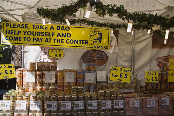 ENGLAND, West Sussex, Shoreham-by-Sea, French Market. Stall with a selection of jars and tinned food on display