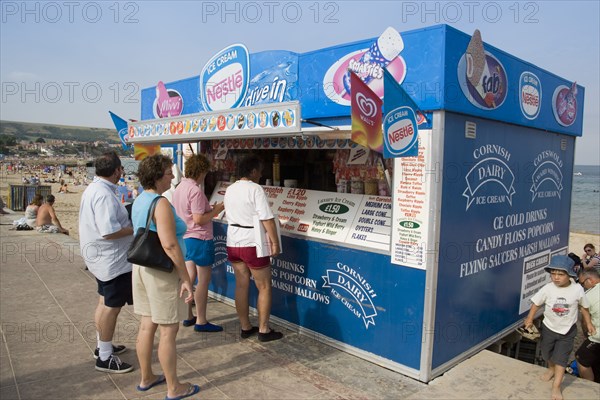 ENGLAND, Dorset, Swanage Bay, People queuing at Ice Cream stall