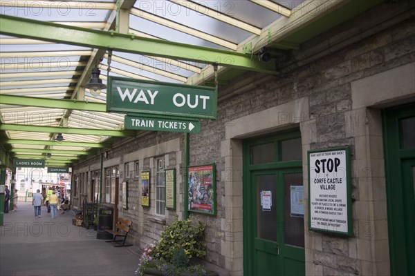 ENGLAND, Dorset, Swanage, Steam Railway Station. Traditional platform station signs indictating the Ticket Office and the Way Out