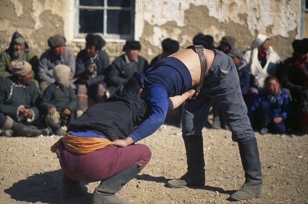 MONGOLIA, Bayan Olgii Province, Nomads, Kazakh nomad wrestlers at Kazakh New Year festivities.