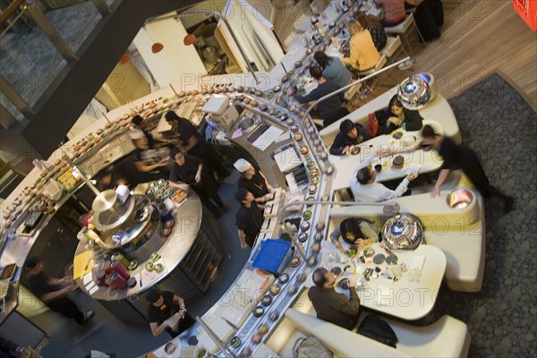 ENGLAND, Kent, Greenhithe, "Bluewater shopping mall, Yo Sushi conveyor Japanese restaurant."