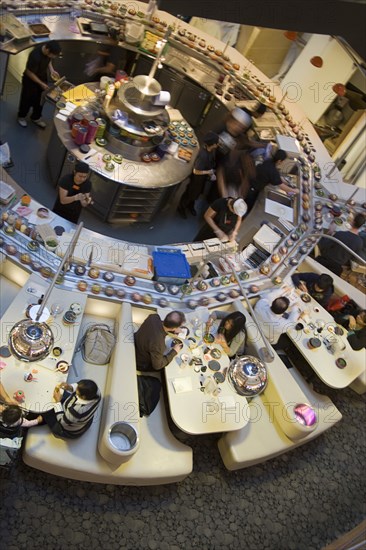 ENGLAND, Kent, Greenhithe, "Bluewater shopping mall, Yo Sushi conveyor Japanese restaurant."