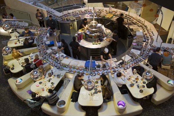 ENGLAND, Kent, Greenhithe, "Bluewater shopping mall, Yo Sushi conveyor Japanese restaurant."