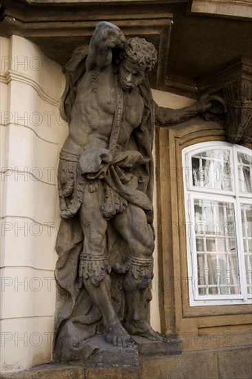 CZECH REPUBLIC, Bohemia, Prague, Balcony support in the form of a man in chains in the Little Quarter