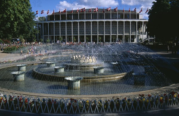 DENMARK , Zealand, Copenhagen, Tivoli Gardens. Concert Hall and fountains.