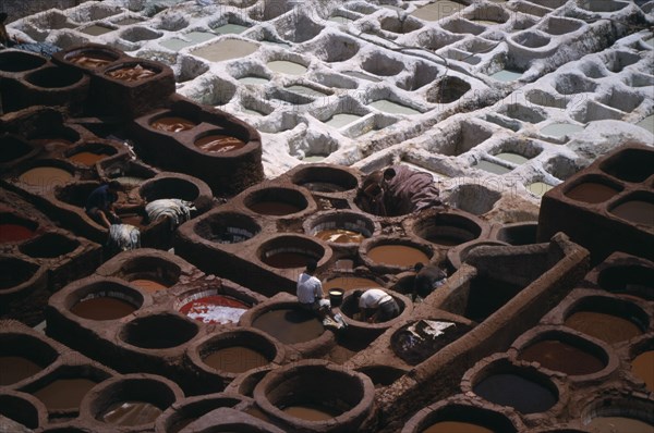 MOROCCO, Fez, The Tanneries with view over workers in dye pits