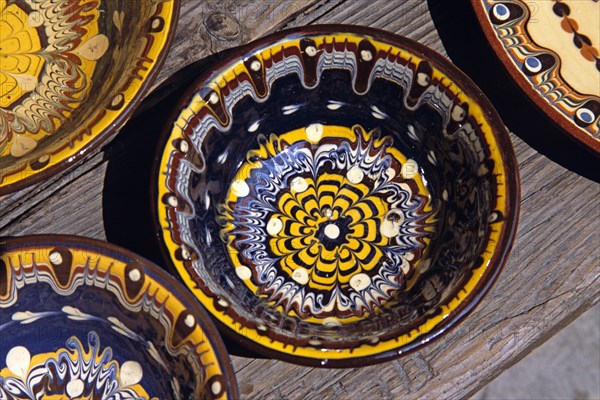 BULGARIA, Veilko Tarnovo, Traditional Bulgarian pottery on display outside gift and craft shop.