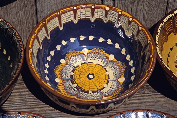 BULGARIA, Veilko Tarnovo, Traditional Bulgarian pottery on display outside gift and craft shop.