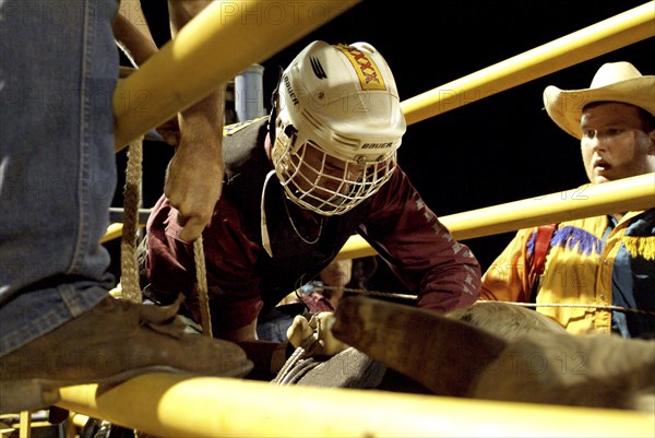 Australia, Northern Territory, Darwin, Darwin Rodeo - the rider waits for the countdown.