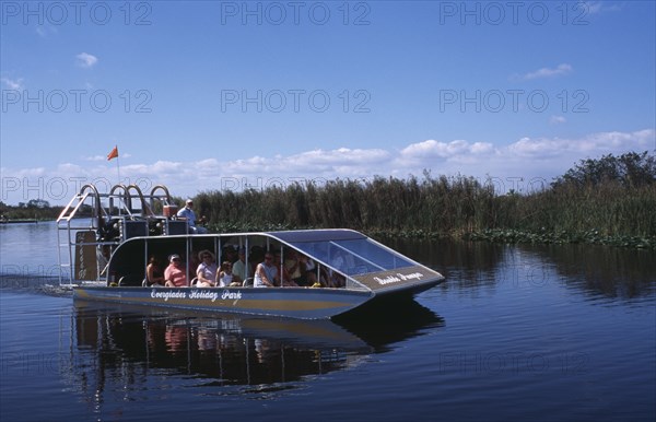 USA, Florida, Fort Lauderdale, Tourists Air boating in the Everglades National Park