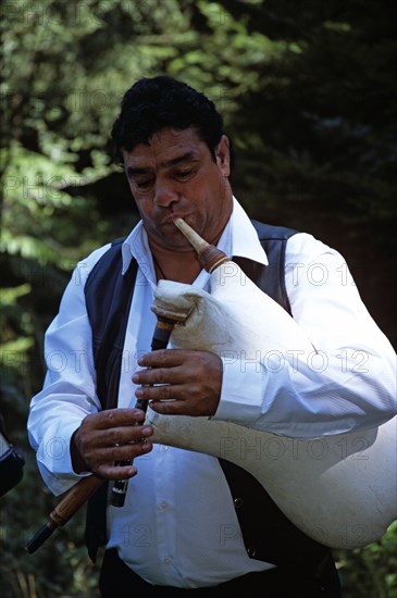 BULGARIA, Chalin Valog, "Musician playing Bulgarian Bagpipes, Pirin Mountain, near Bansko."