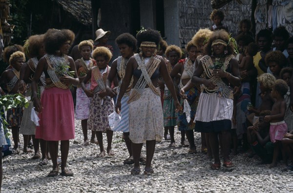 PACIFIC ISLANDS, Melanesia, Solomon Islands, "Malaita Province, Lau Lagoon, Foueda Island.  Dance performed to celebrate forthcoming wedding.  Girls wearing multi-strand shell and coral neacklaces. "