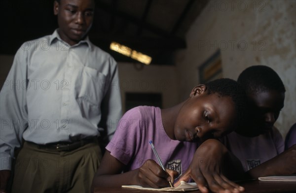 UGANDA, Iganga, Teacher and pupils in intergrated education project for the visually impaired.