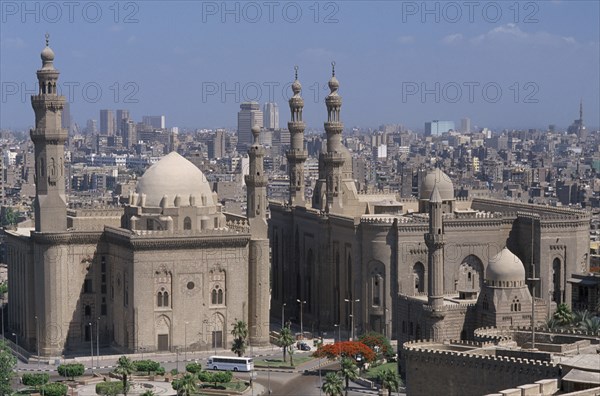EGYPT, Cairo Area, Cairo , Sultan Hassan Mosque on the left and the later built El Rifai Mosque on the right seen from the Citadel